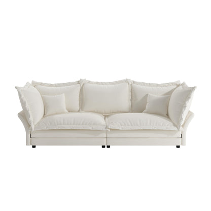 Canapés modernes à assise profonde avec plusieurs grands coussins moelleux
