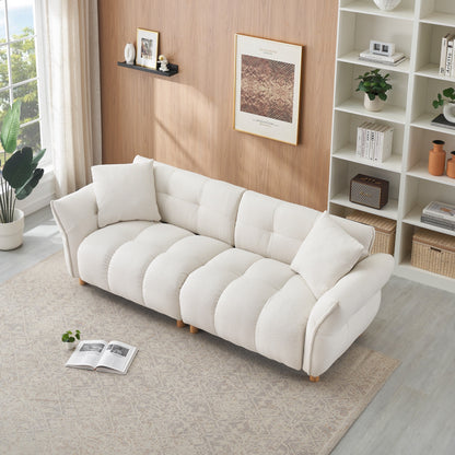 Canapé Teddy de 240 cm de long, avec deux coussins assortis et trois sièges spacieux et confortables.