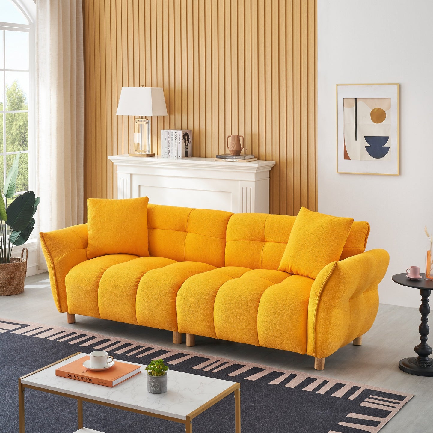 Canapé Teddy de 240 cm de long, avec deux coussins assortis et trois sièges spacieux et confortables.
