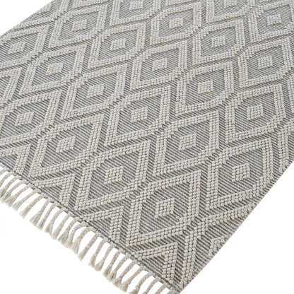 Tapis en laine tissé à la main Avanti gris clair et crème à pompons en losanges