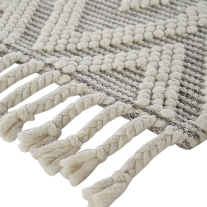 Tapis en laine tissé à la main Avanti gris clair et crème à pompons en losanges