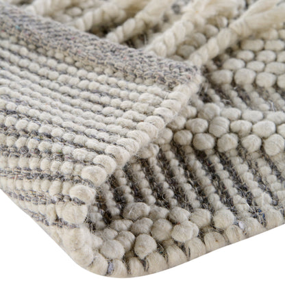 Tapis en laine tissé à la main Avanti gris clair et crème à pompons en losanges