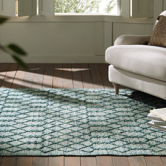 Tapis en laine à pompons aigue-marine tissé à la main Avanti