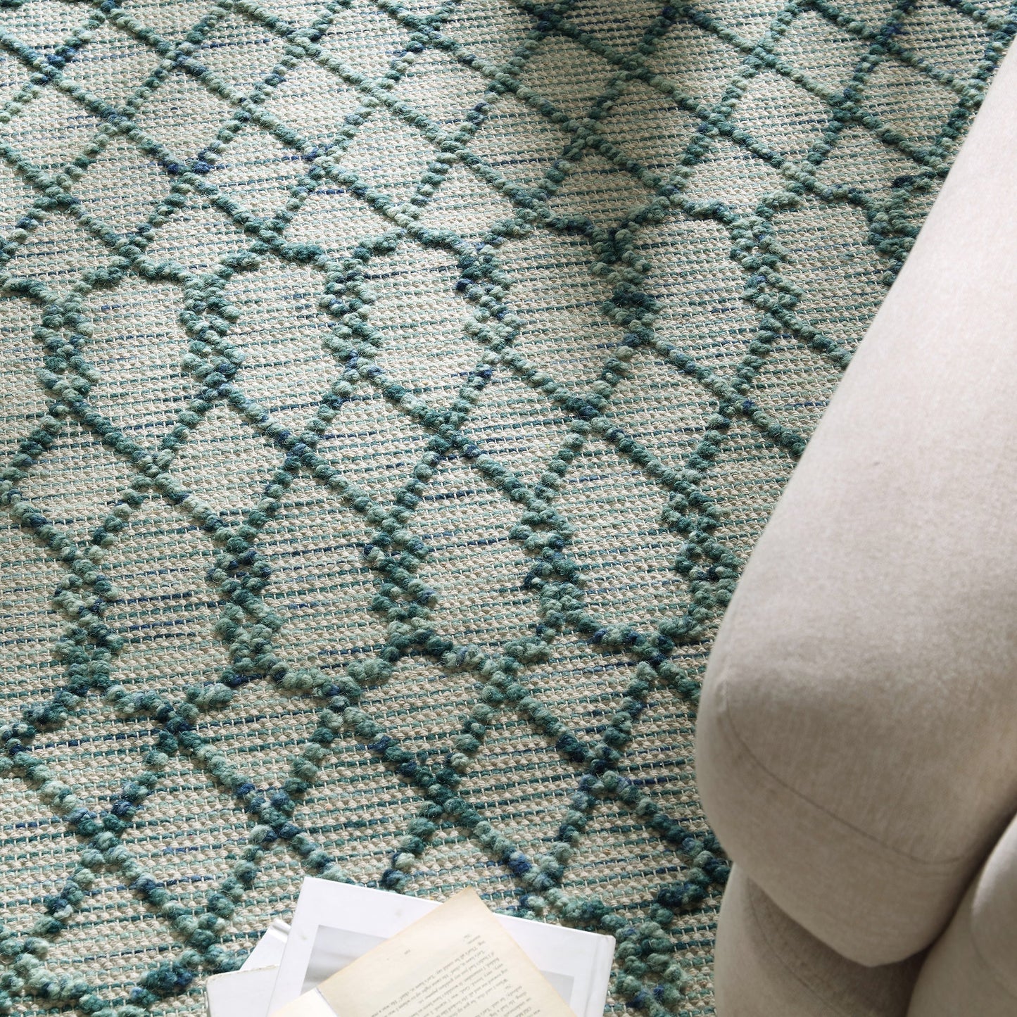 Tapis en laine à pompons aigue-marine tissé à la main Avanti
