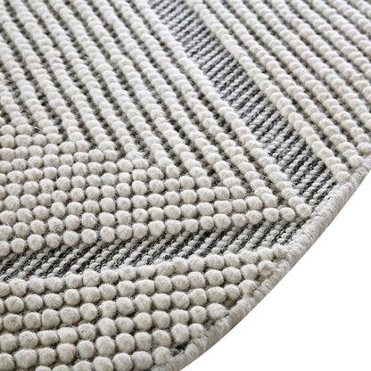 Tapis rond en laine tissé à la main Avanti, motif sel et poivre, à pompons et diamants