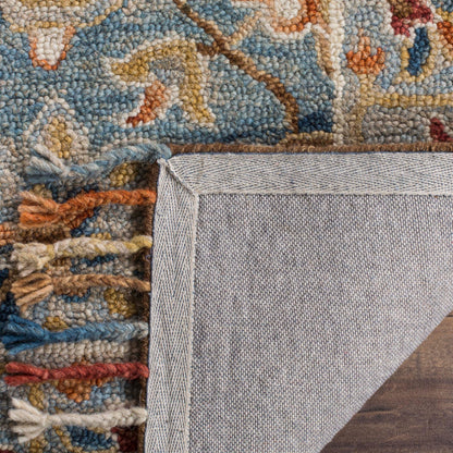 Tapis en laine à pompons Aspen Kimm Boho fait main SAFAVIEH