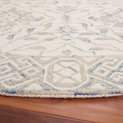 Tapis en laine Elvedina à motif floral, teint à la main par SAFAVIEH