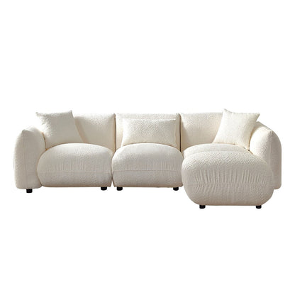 Canapé sectionnel blanc rembourré et confortable en duvet d'agneau doux avec pouf