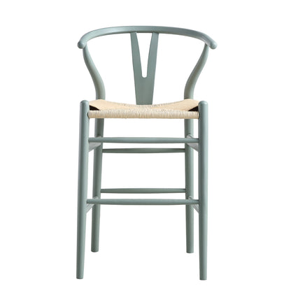 Tabouret de bar Hansel en bois tressé naturel, structure vert sauge