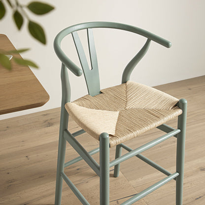 Tabouret de bar Hansel en bois tressé naturel, structure vert sauge