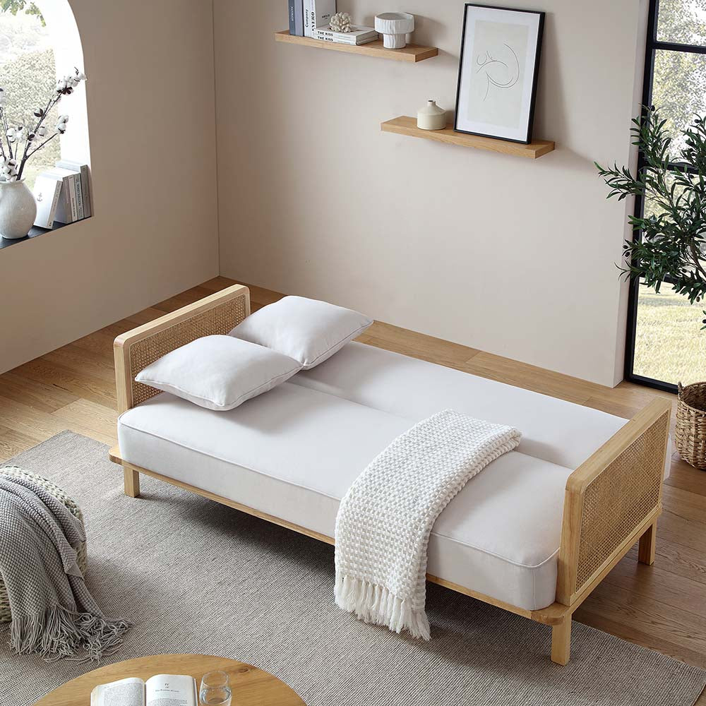 Canapé-lit Pienza en bois massif et rotin, tissu beige avec cadre naturel